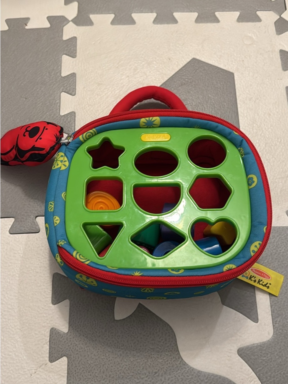 Melissa & Doug Blue Carrying Case Shape Sorter with Green Top & Red Trim